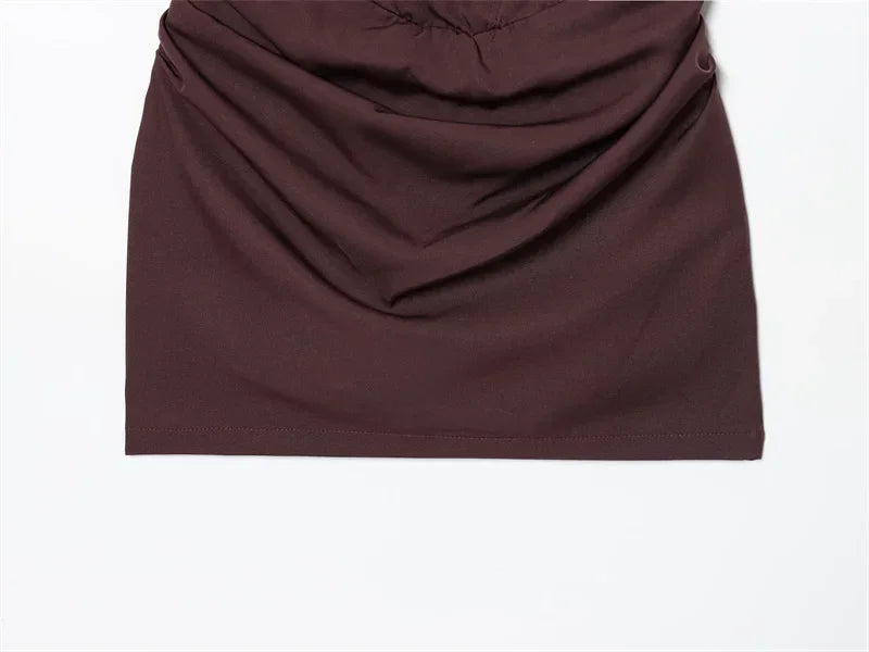 Dark brown ruched mini skirt with smooth fabric and clean hemline