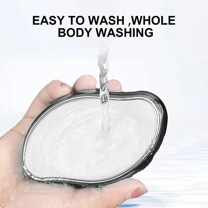 Hand holding washable body sponge under running water for easy cleaning